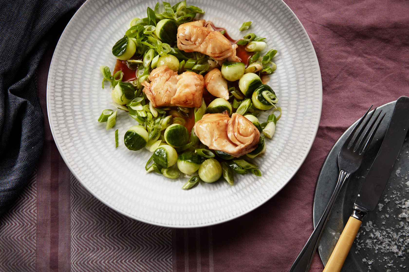 Fried cod with spring onion and cucumber