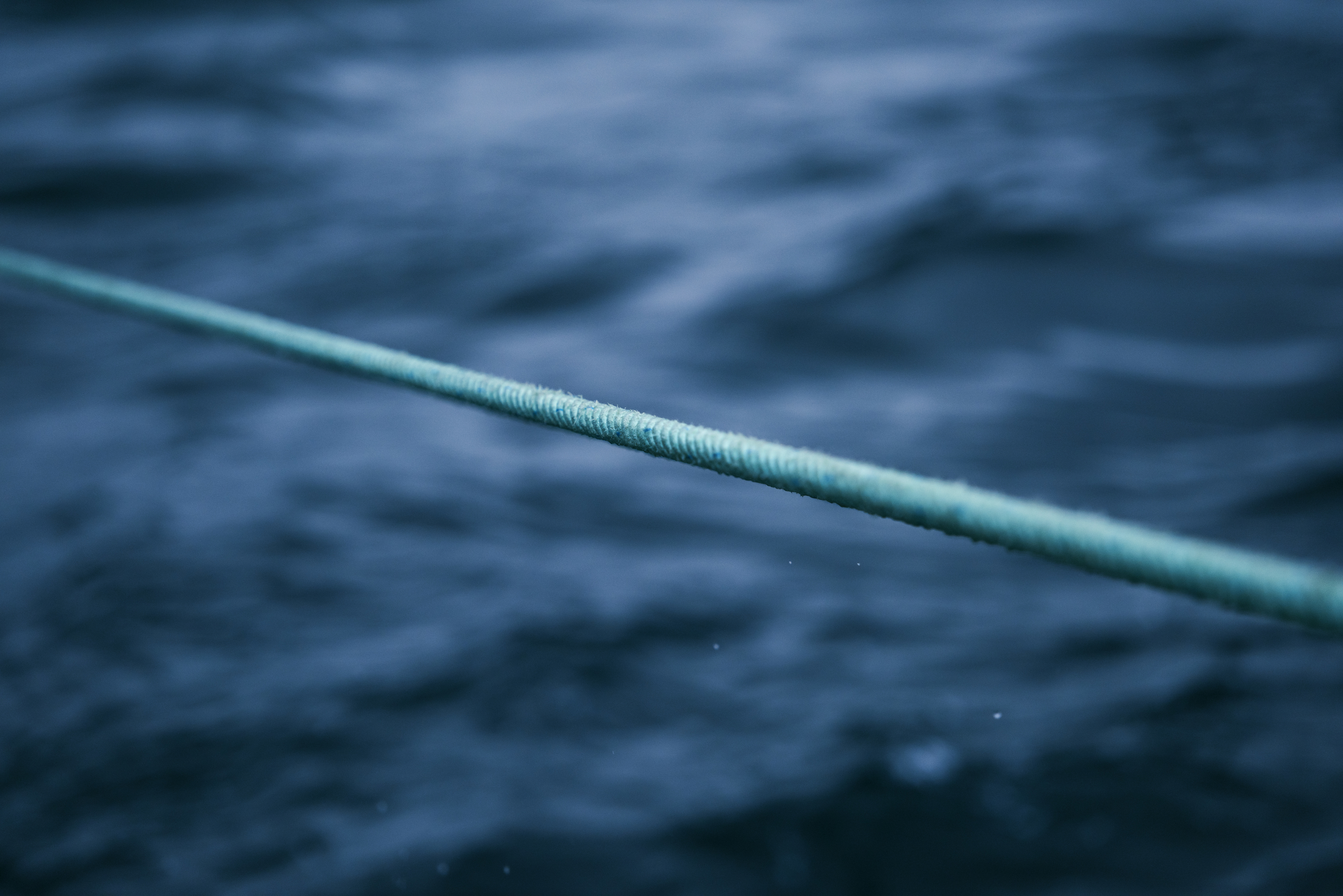 Green rope from fishing boat