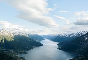 Norwegian fjord lanscape with blue sky and clouds