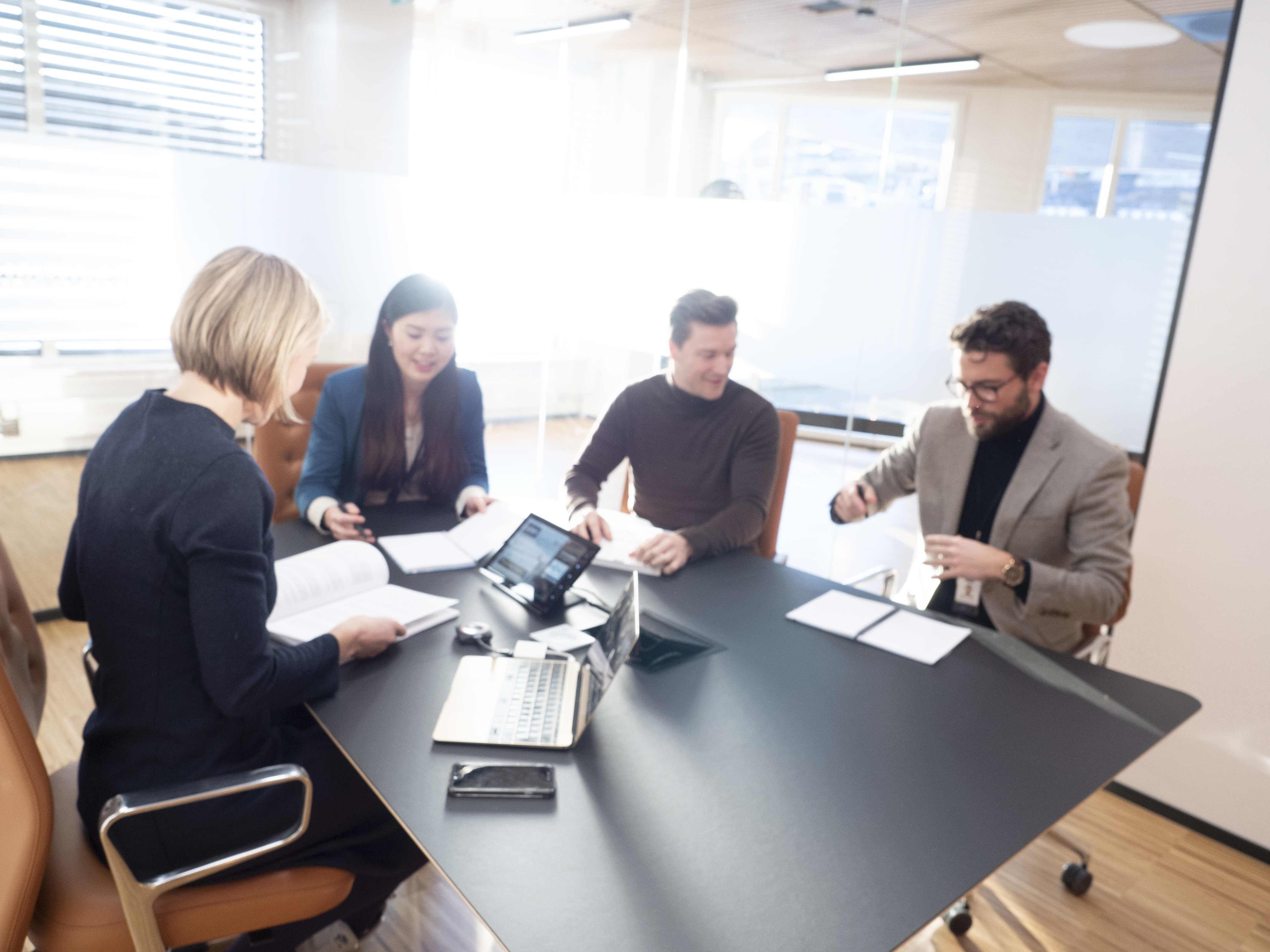 Employees together in a meeting room