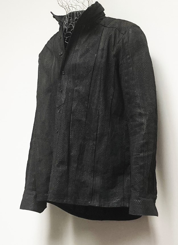 A black leather jacket made from fish leather. 