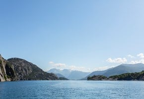 Fjord and mountains in the sun