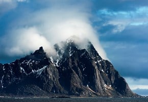 Pointy mountain with clouds in Northern Norway