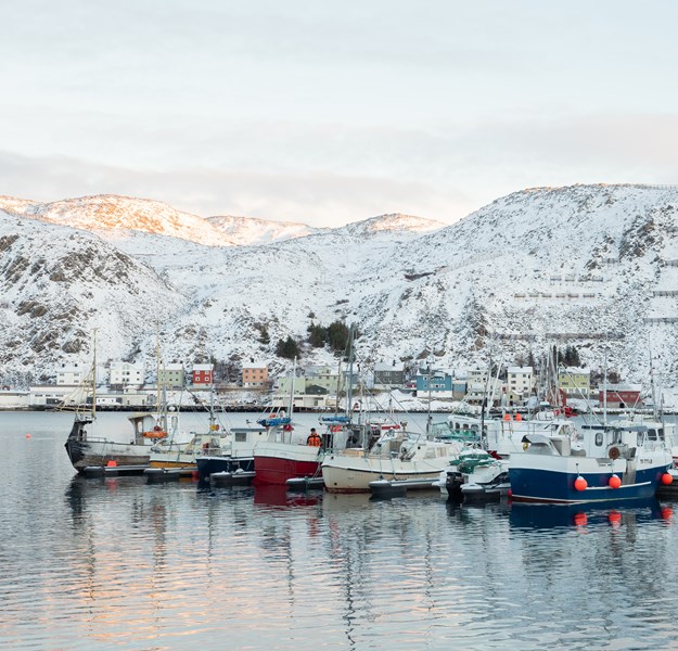 Kjøllefjord by the water with fishing boats in front