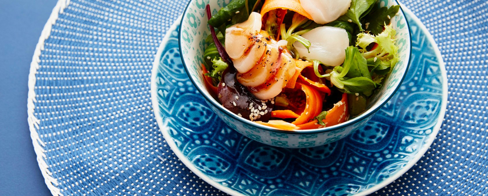 Poké bowl with seafood and poké sauce