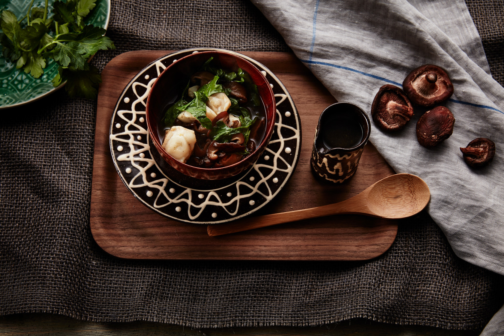 Hotpot with cod, mushrooms and herbs in stock