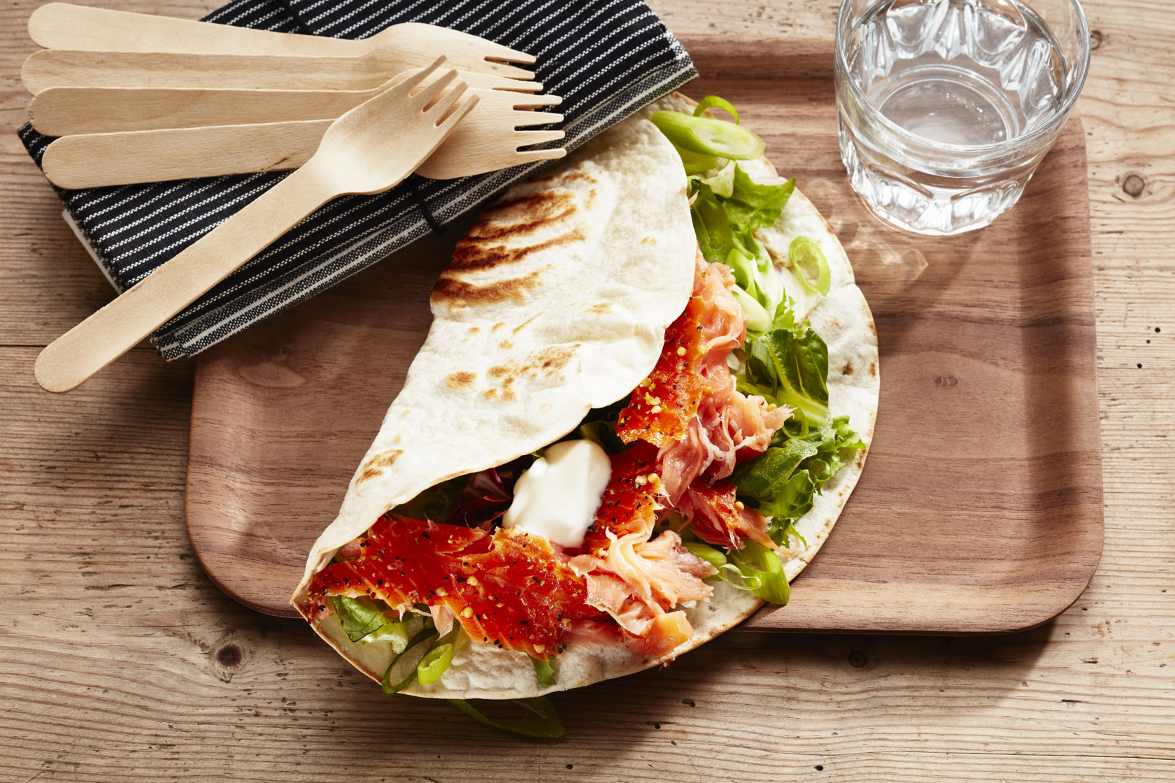 Wrap with salmon, spring onion and yoghurt