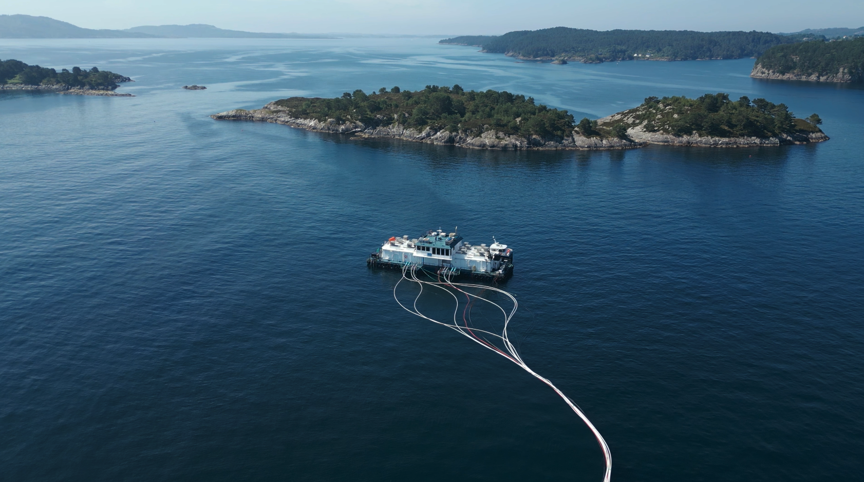 Drone photo of sea and aqua culture cages on the norwegian coast